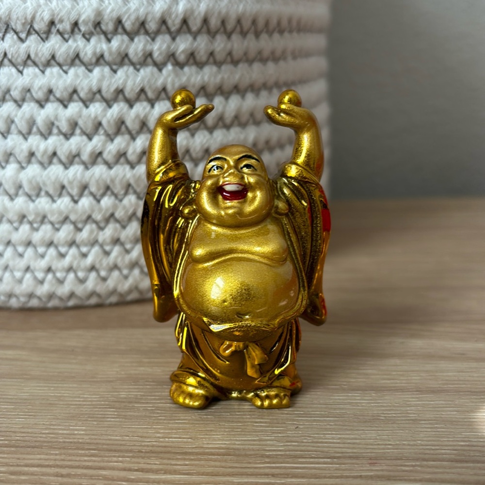 Gold Buddha with yellow bow